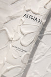 Alpha-H Balancing Cleanser tube i teksturen