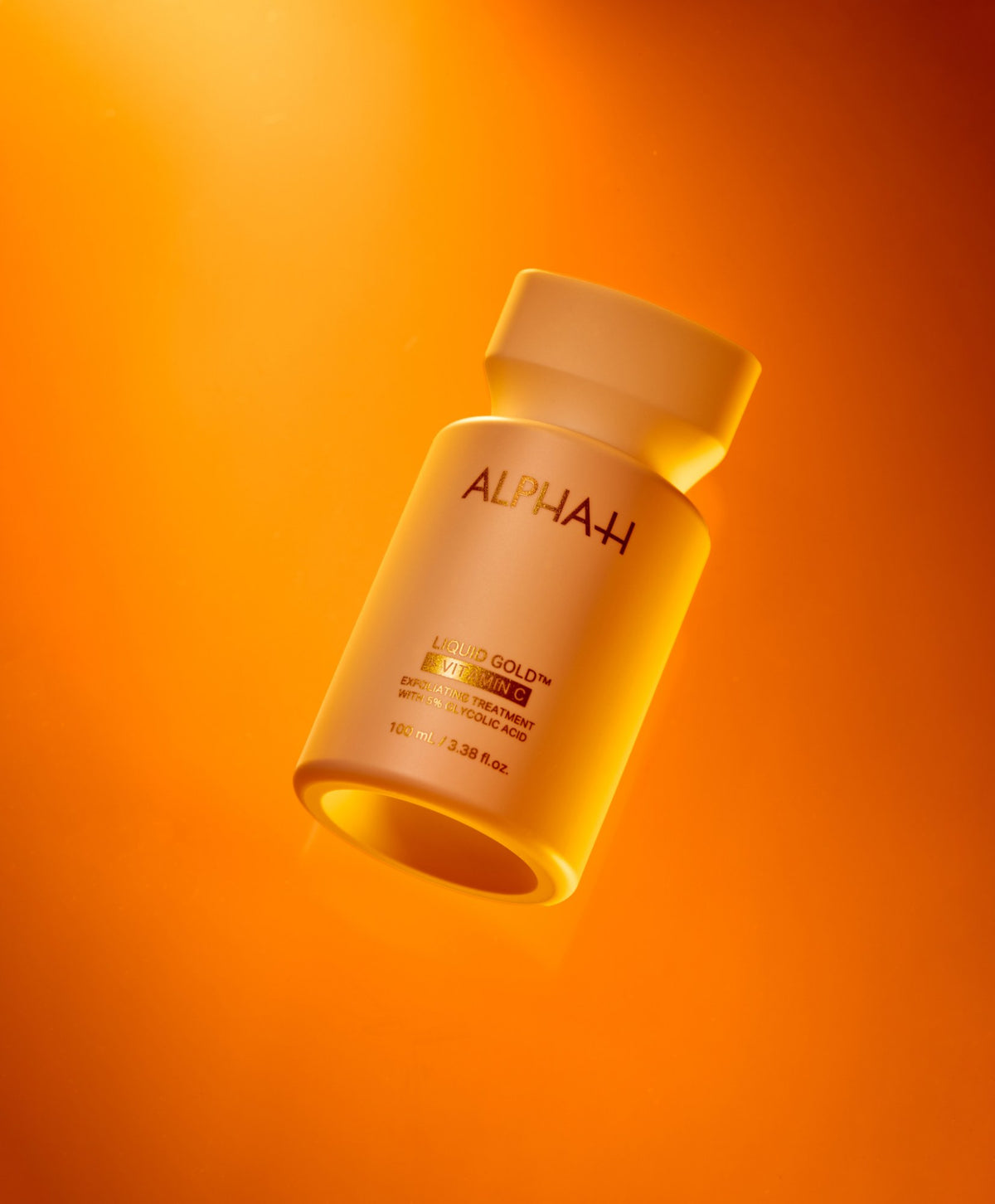 Alpha-H Liquid Gold + Vitamin C Exfoliating Treatment flakon i orange lys
