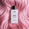 BDK Parfums Hair Perfume Bouquet de Hongrie flakon på lyserødt hår