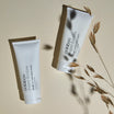 Oolaboo Super Foodies Velvety Hand Lotion ved siden af All Over Gentle Scrub