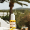 Prescription SPF50 Drops 30ml flacon in de zon met palmboom