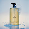 Salt & Stone Body Wash Santal & Vetiver flacon met water